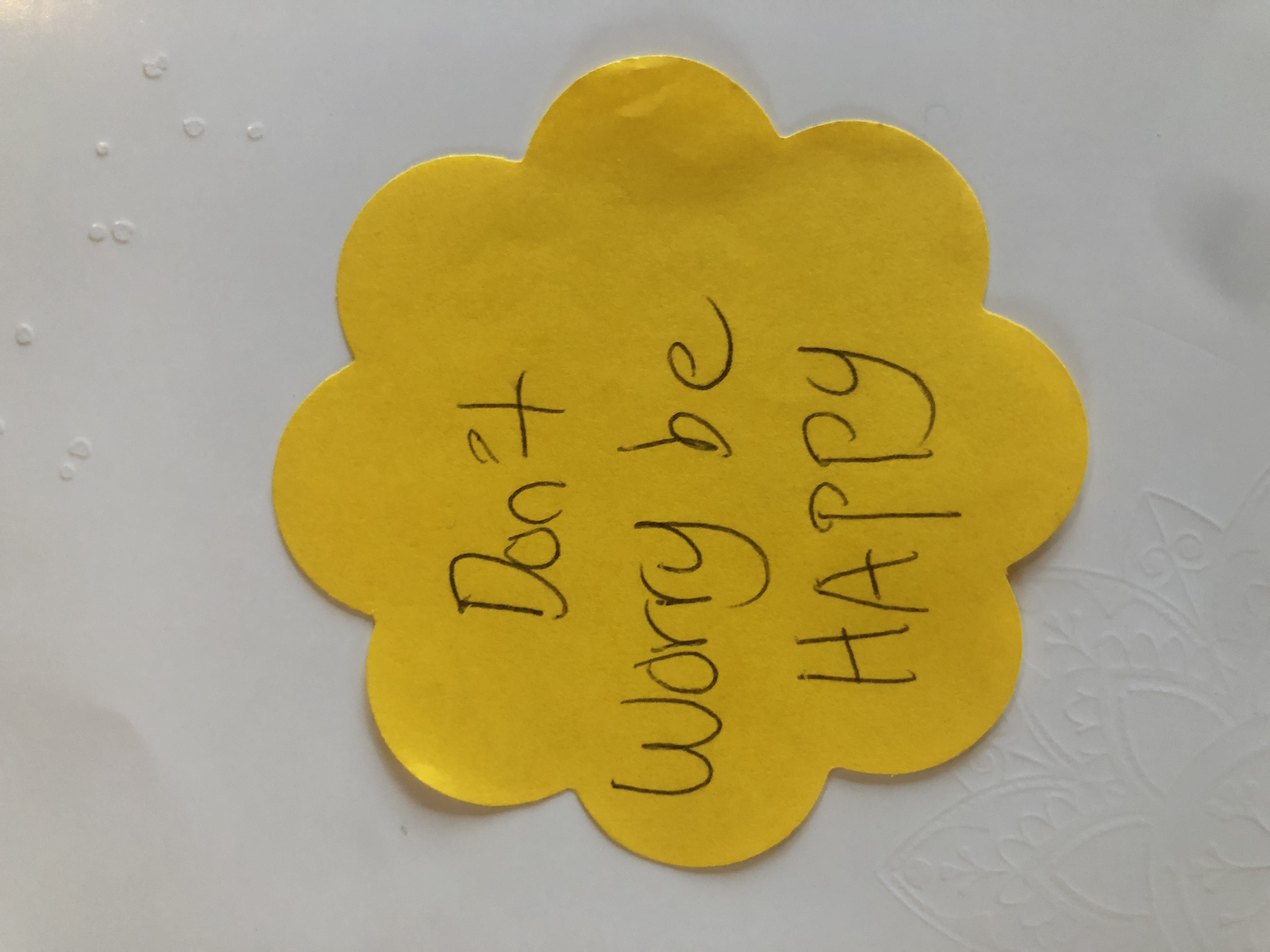 Delaney's handwritten Don't Worry Be Happy sticker